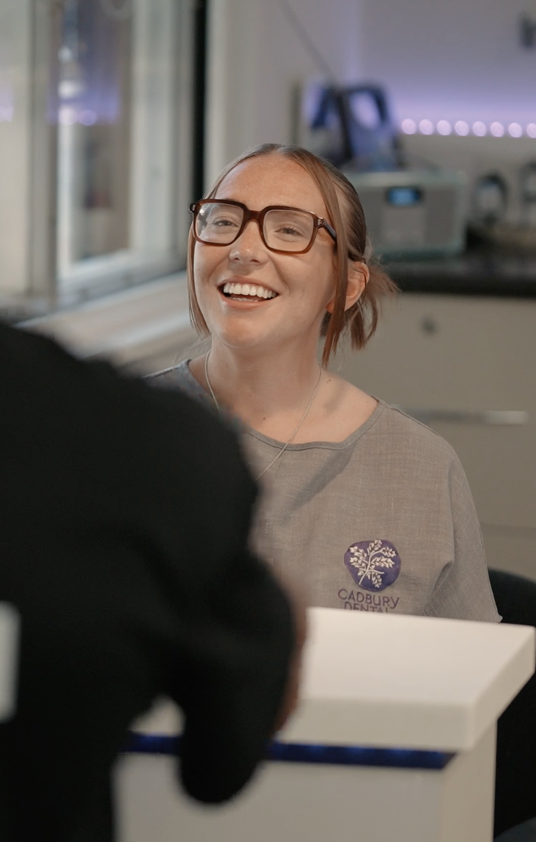 Cadbury Dental reception team greeting a patient for a dental check-up in Bournville, Birmingham